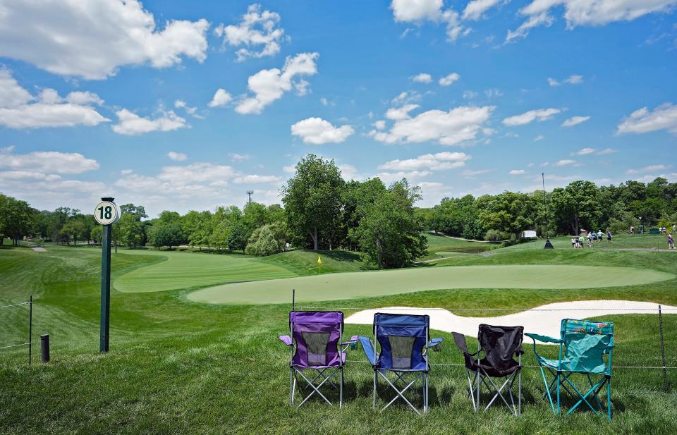 The first four lawn chairs sit along the ropes of the 18th green on Monday afternoon before the start of the Memorial Tournament at Muirfield Village Golf Club in Dublin.