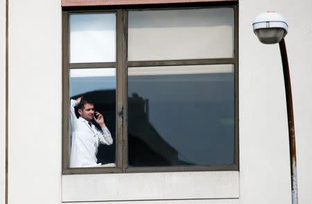 A doctor speaks on the phone inside the hospital after an incident in which a gunman fired shots inside the Bronx-Lebanon Hospital in New York City, U.S. June 30, 2017. REUTERS/Brendan Mcdermid