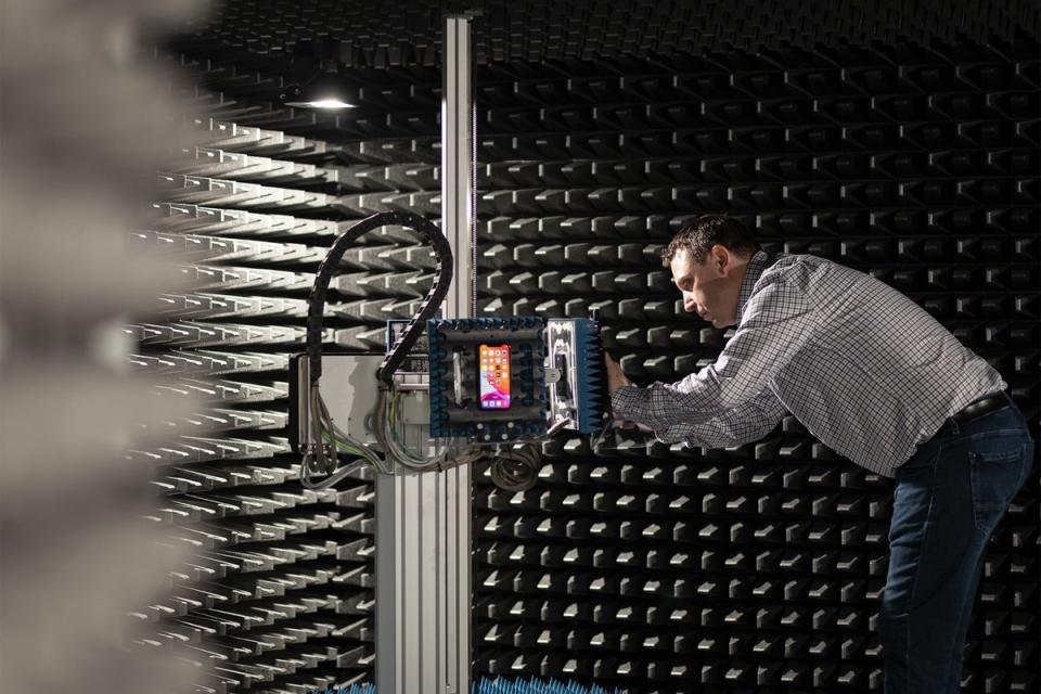 The room in Apple’s Munich lab used for testing the phones’ cellular connections. Devices can be placed in the arms and moved around – nearer and further from the cellular base stations at the other side of the room – to simulate real life use. (Apple)