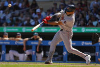 Boston Red Sox's Dominic Smith hits a two-run double against the Minnesota Twins in the eighth inning of a baseball game Sunday, May 5, 2024, in Minneapolis. (AP Photo/Bruce Kluckhohn)
