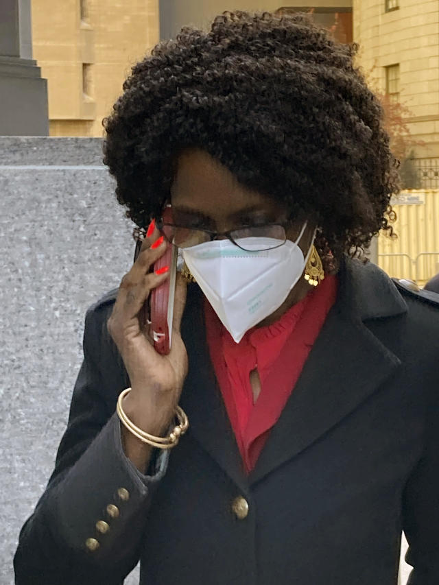 Ex-State Supreme Court Justice Sylvia Ash talks into her phone as she leaves Manhattan federal court after she was sentenced to a year and three months in prison, Wednesday, April 20, 2022 in New York. Ash, a former New York state judge was sentenced Wednesday to a year and three months in prison after her conviction for obstructing a probe into financial wrongdoing at a credit union that provides banking services to tens of thousands of New York City employees, including police and firefighters. (AP Photo/Larry Neumeiste)