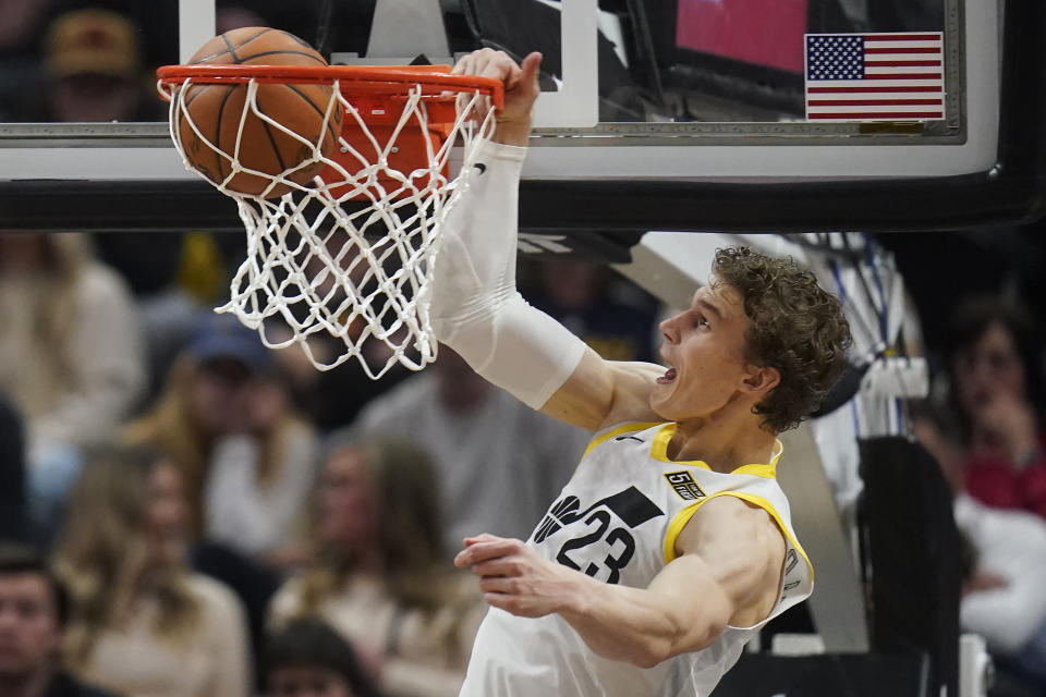 Utah Jazz forward Lauri Markkanen (23) dunks against the Dallas Mavericks during the first half of an NBA basketball game Monday, Feb. 6, 2023, in Salt Lake City. (AP Photo/Rick Bowmer)