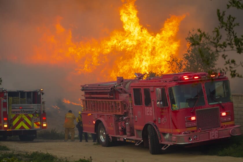 Castaic, CA - APRIL 28: A fire in the Castaic and Valencia area quickly spread to at least 650 acres, triggering mandatory evacuation orders and road closures in the area on Wednesday, April 28, 2021 in Valencia, CA. (Francine Orr / Los Angeles Times)