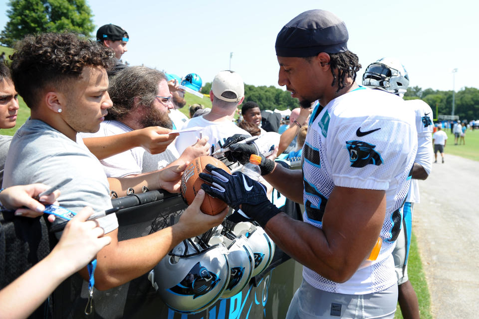 Carolina Panthers safety Eric Reid, right, will continue his silent protest this season. (Getty Images)