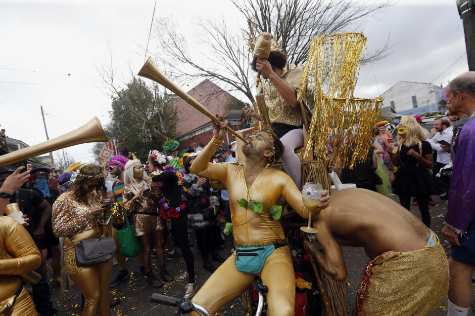 FILE - In this Feb. 28, 2017 file photo, revelers congregate at the start of the Society of Saint Anne Mardi Gras parade in New Orleans. The final weekend of Mardi Gras season in New Orleans has begun with a warning from police that crowds won't be tolerated as the city fights to stop the spread of the coronavirus. Police chief Shaun Ferguson noted Friday, Feb. 12, 2021, that bars throughout the city were being ordered to close through Fat Tuesday. And he said police will man barricades limiting pedestrian traffic on Bourbon Street to people who live or work there, hotel guests, and restaurant patrons. (AP Photo/Gerald Herbert, File)