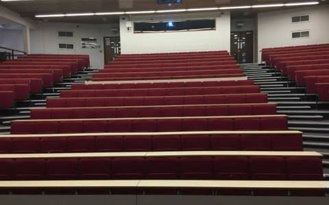 A photograph of an empty lecture theatre 