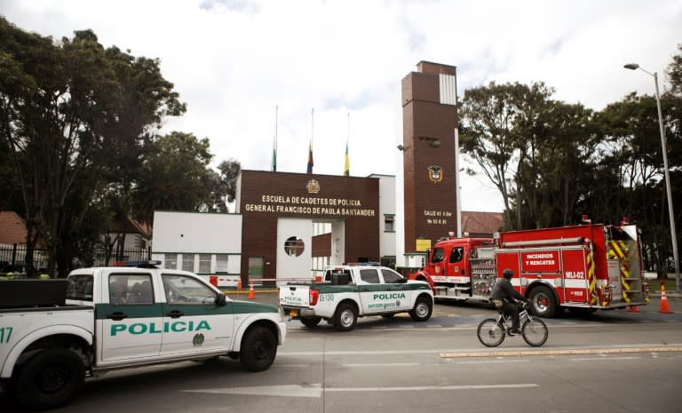 Police cars and a fire truck were parked outside General Santander Police Academy in Bogota one a day after the deadly car bombing blamed on leftist ELN guerrillas