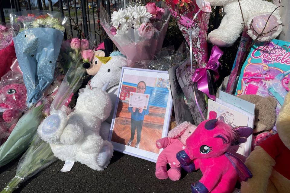 Flowers and toys left near Shay’s home (PA Wire)