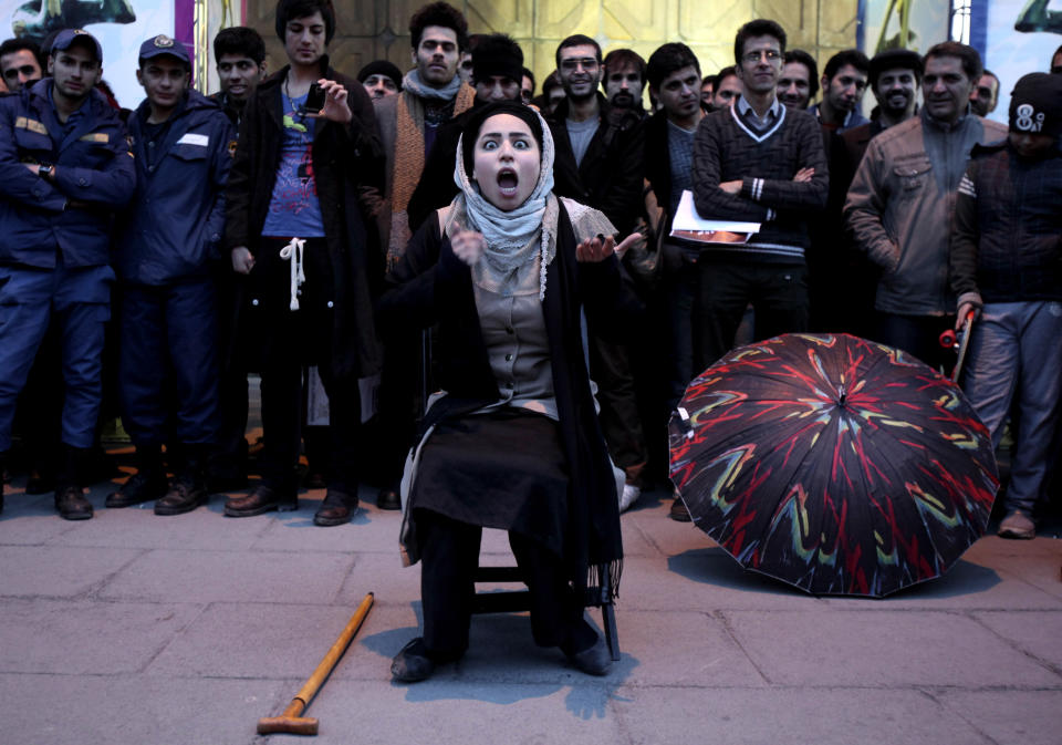 Iranian actress Elaheh Pourjamshid, performs her role as a mother in 'Awakening of The Particles' street theater, telling a story on children's education, during the 31st Fajr International Theater Festival, in central Tehran, Iran, Thursday, Jan. 17, 2013. IIran holds the Fajr festival, the most important theatrical event in the country, along with film, music, and visual arts, marking the anniversary of the 1979 Islamic revolution. (AP Photo/Vahid Salemi)