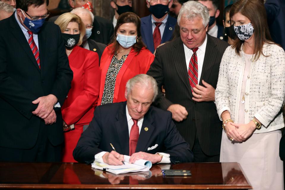 South Carolina Gov. Henry McMaster signs into law a bill banning almost all abortions in the state Thursday, Feb. 18, 2021, in Columbia.