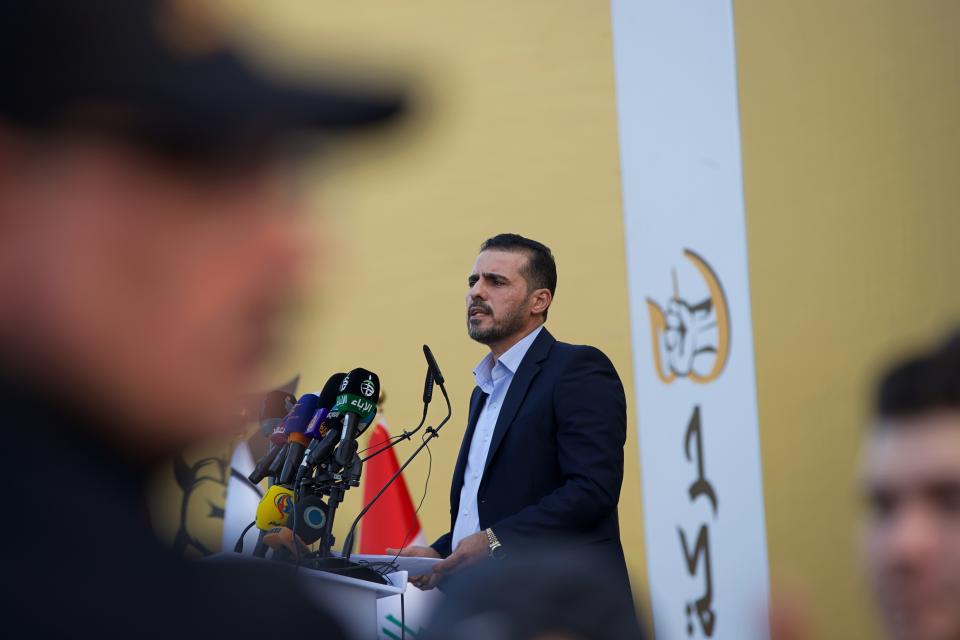 Hussein Muanis, the leader of a political movement called "Harakat Huqooq, Arabic for Rights Movement, speaks at a press conference announcing his electoral program for the upcoming parliamentary elections in Baghdad, Iraq, Friday, Sept. 3, 2021. Muanis is the leader of Kataeb Hezbollah, one of the most hard-line and powerful militias with close ties to Iran, who once battled U.S. troops. He is the first to be openly affiliated with Kataeb Hezbollah or Hezbollah Brigades, signaling the militant group’s formal entry into politics. (AP Photo/Hadi Mizban)