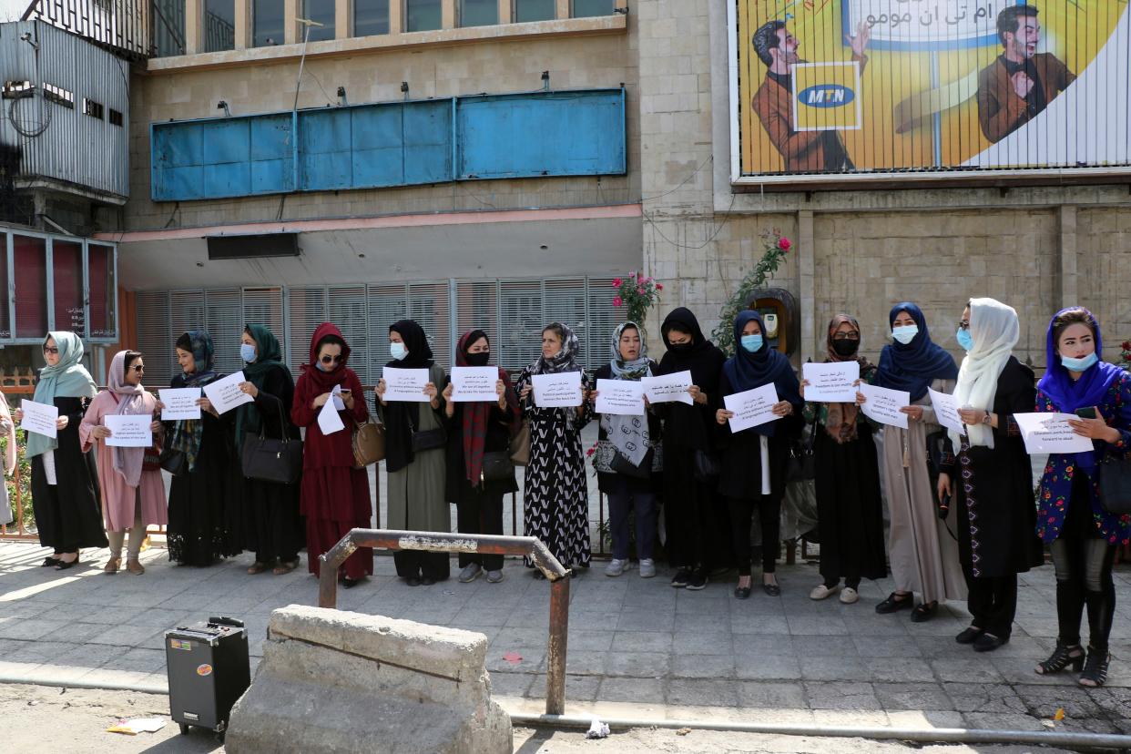 Women gather to demand their rights under the Taliban rule during a protest in Kabul, Afghanistan, Friday, Sept. 3. 