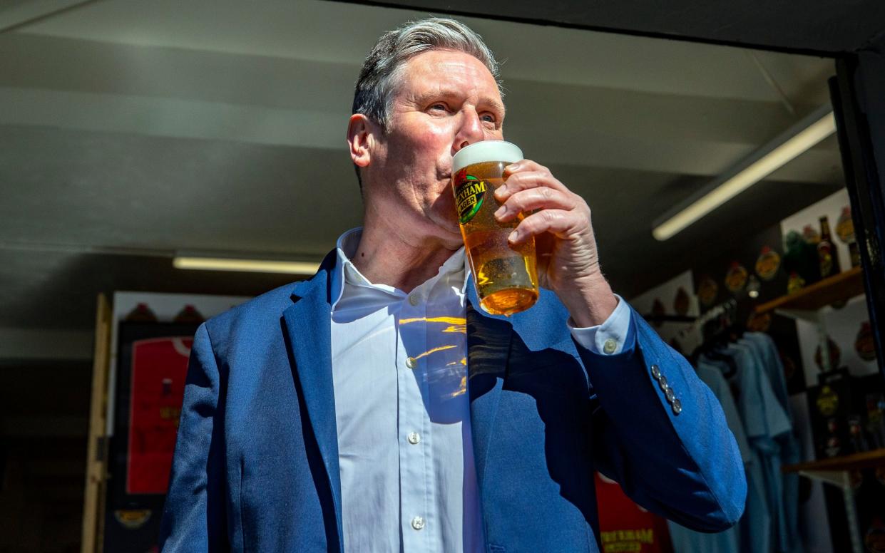 Sir Keir Starmer, the Labour leader, drinks a pint during a visit to the Wrexham Lager Brewery in 2021 - Peter Byrne/PA Archive