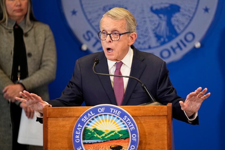 Gov. Mike DeWine speaks about the East Palestine train derailment with his cabinet officials during a press conference in his office.