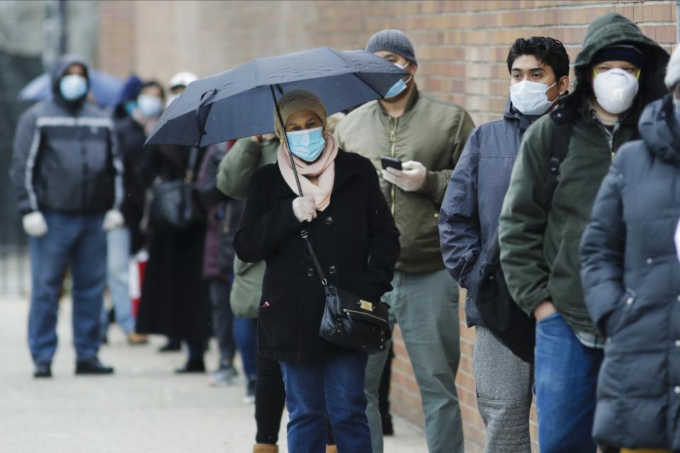 People line up at Gotham Health East New York, a COVID-19 testing center Thursday, April 23, 2020, in the Brooklyn borough of New York. (AP Photo/Frank Franklin II)