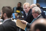 Alex Murdaugh, center, speaks with attorney Dick Harpootlian during Murdaugh's double murder trial at the Colleton County Courthouse in Walterboro, S.C., Friday, Feb. 3, 2023. The 54-year-old attorney is standing trial on two counts of murder in the shootings of his wife and son at their Colleton County home and hunting lodge on June 7, 2021. (Sam Wolfe/The State, Pool)