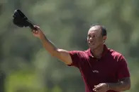 Tiger Woods waves after his final round at the Masters golf tournament at Augusta National Golf Club Sunday, April 14, 2024, in Augusta, Ga. (AP Photo/David J. Phillip)