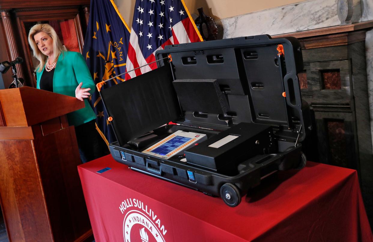 Secretary of State Holli Sullivan shows a Voter-Verifiable Paper Audit Trail (VVPAT), during a press conference Thursday, March 17, 2022 at the Indiana Statehouse.