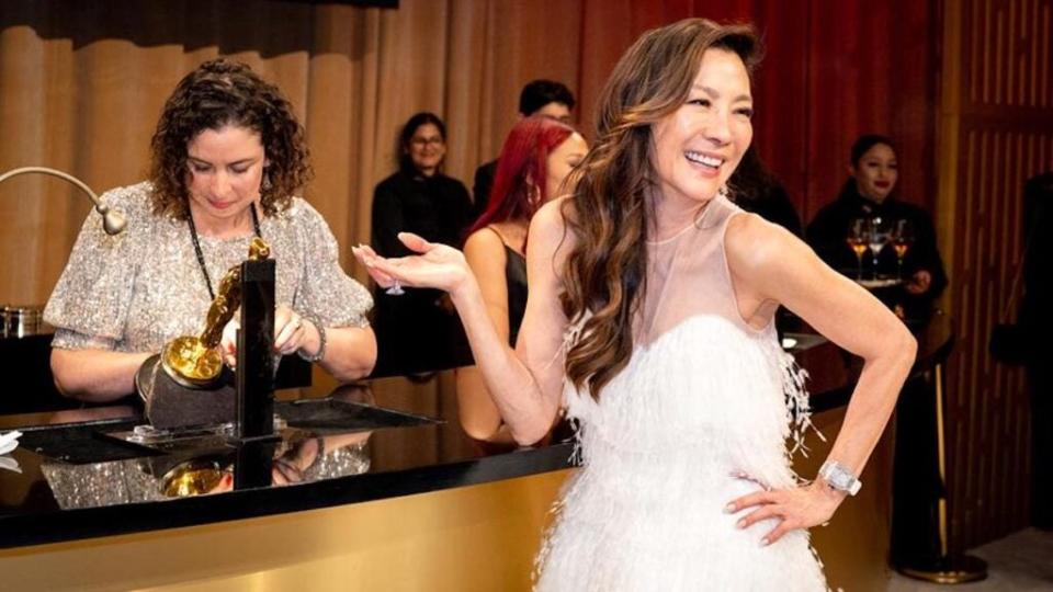 Michelle Yeoh, winner of the Best Actress Oscar for “Everything Everywhere All at Once,” gets her trophy engraved at the 95th Annual Academy Awards Governors Ball at Dolby Theatre in Hollywood. (Emma McIntyre/Getty Images)