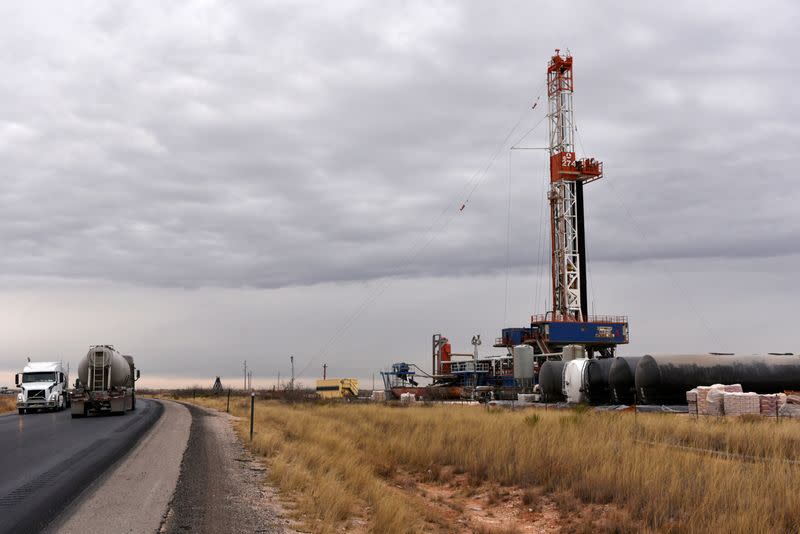 FILE PHOTO: A drilling rig operates in the Permian Basin oil and natural gas producing area in Lea County