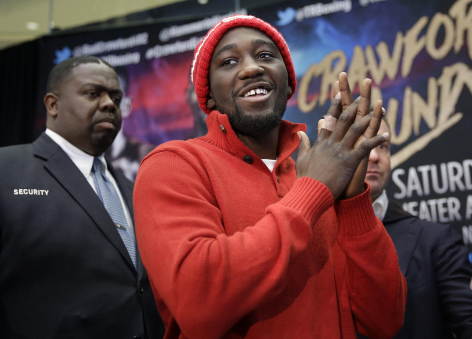 Boxer Terence Crawford smiles during a news conference in New York, Tuesday, Jan. 12, 2016. Crawford will defend his WBO junior welterweight championship belt against Hank Lundy at Madison Square Garden in New York on Saturday, Feb. 27, 2016. (AP Photo/Seth Wenig)