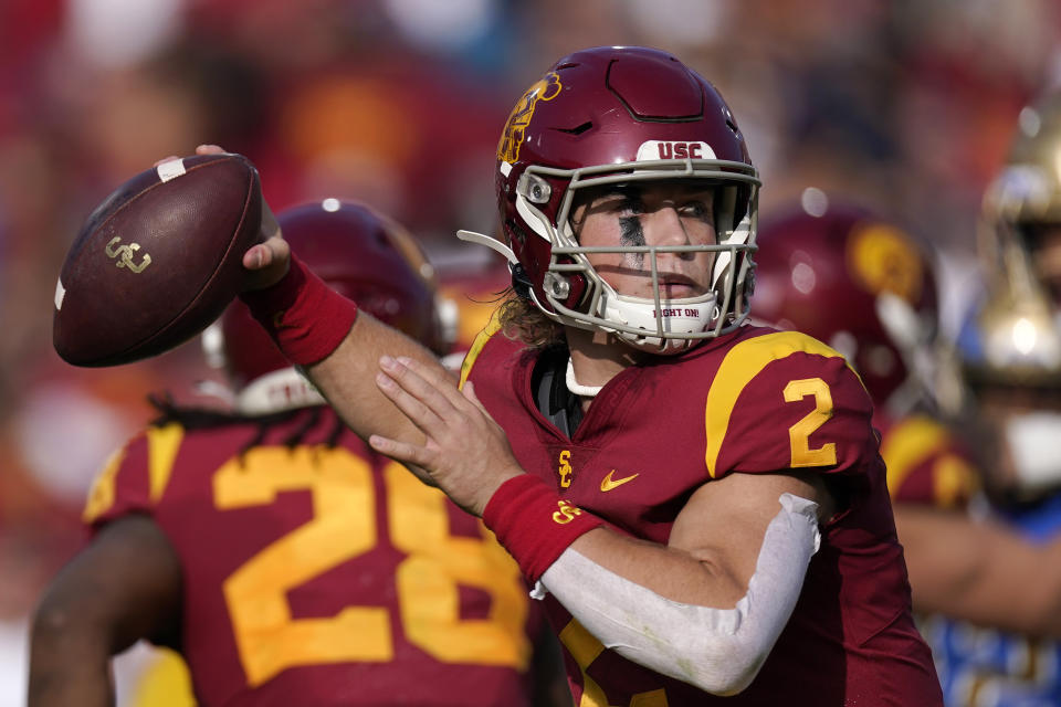 Southern California quarterback Jaxson Dart passes during the first half of an NCAA college football game against UCLA Saturday, Nov. 20, 2021, in Los Angeles. (AP Photo/Mark J. Terrill)