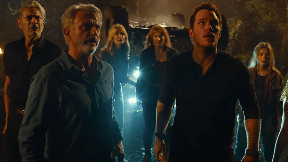 Jurassic World Dominion the cast stands stunned while in a burning forest in Jurassic World: Dominion,