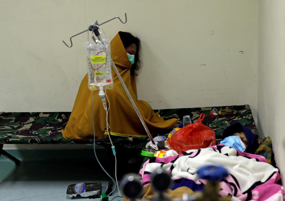 People rest on camp beds inside the emergency ward for coronavirus disease (COVID-19) patients at a government-run hospital in Jakarta, Indonesia, June 29, 2021. REUTERS/Willy Kurniawan     TPX IMAGES OF THE DAY