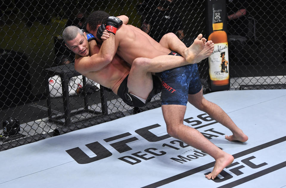 LAS VEGAS, NEVADA - DECEMBER 05:   In this UFC handout,(R-L) Jordan Leavitt slams Matt Wiman in a lightweight bout during the UFC Fight Night event at UFC APEX on December 05, 2020 in Las Vegas, Nevada. (Photo by Chris Unger/Zuffa LLC via Getty Images)