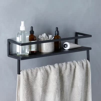 Gain some extra bathroom storage with this space-saving towel rail shelf