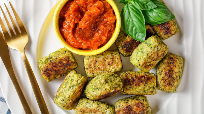 Tater tots made of broccoli with marinara sauce