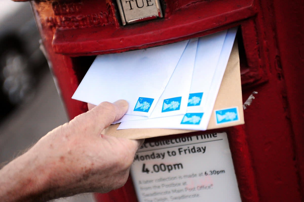 Postage times close to Christmas can get busy, with millions of people sending cards and presents across the UK (Rui Vieira/PA)