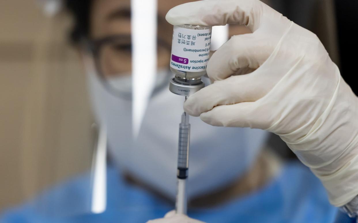A vial filled with a dose of the Oxford/AstraZeneca vaccine - Seong Joon Cho/Bloomberg