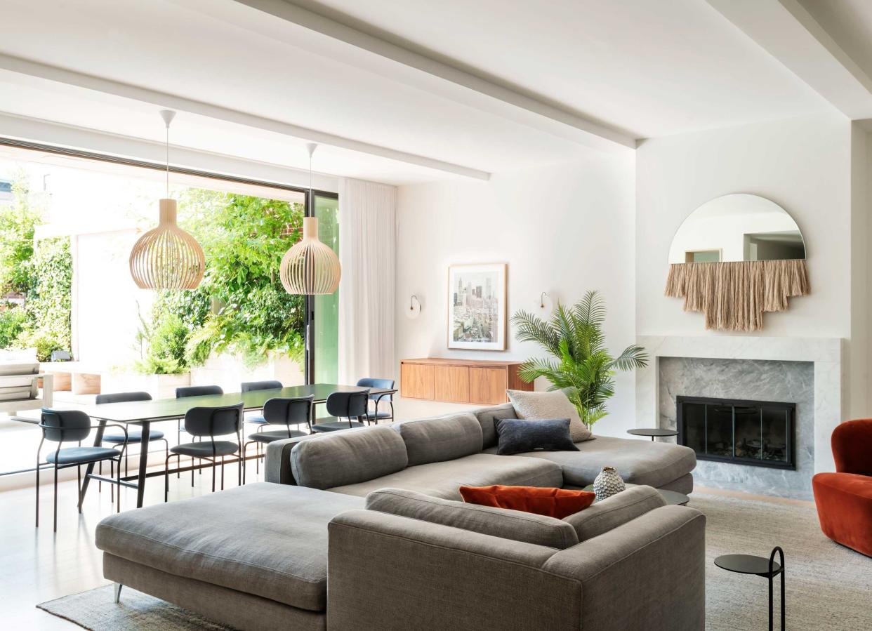  A living room with doors out to a terrace. 