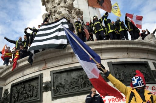 The firefighters took their protest to the emblematic statue of Marianne in the central Place de la Republique