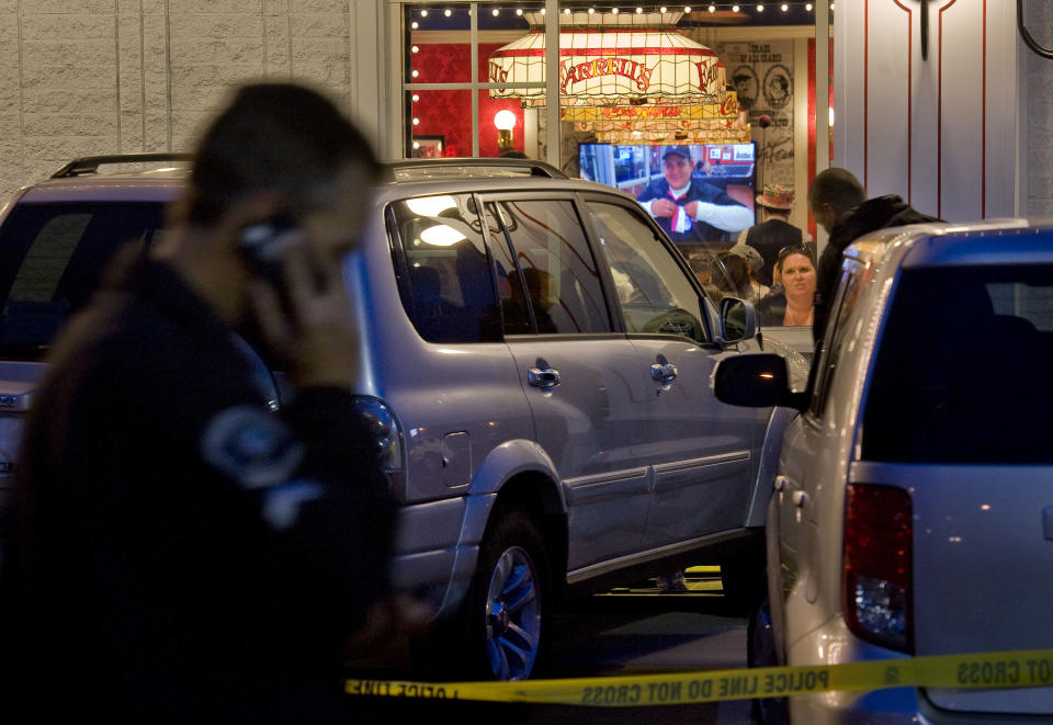 Police investigate a fatal parking lot accident in which a man in his 70's driving an SUV lost control and drove into a line of people waiting to enter Farrell's Ice Cream Parlour in Buena Park Friday April 25, 2014. One woman was pronounced dead after being taken to UCI Medical Center in Orange and six other people were injured in the accident. (AP Photo/The Orange County Register, Paul Rodriguez)