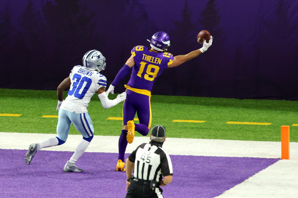 Adam Thielen #19 of the Minnesota Vikings catches a touchdown pass against Anthony Brown #30 of the Dallas Cowboys in the third quarter during their game at U.S. Bank Stadium on November 22, 2020 in Minneapolis, Minnesota. (Photo by Adam Bettcher/Getty Images)