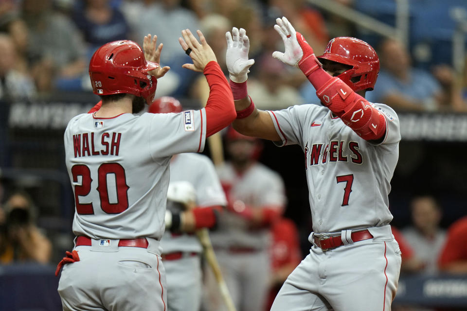 Los Angeles Angels right fielder Jo Adell (7) celebrates his two-run home run off Tampa Bay Rays relief pitcher Shawn Armstrong with Jared Walsh (20) during the sixth inning of a baseball game Thursday, Sept. 21, 2023, in St. Petersburg, Fla. (AP Photo/Chris O'Meara)