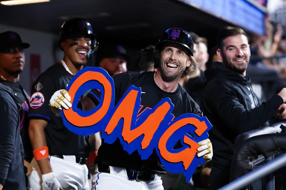 NEW YORK, NEW YORK - JUNE 28: Jeff McNeil #1 of the New York Mets holds an OMG sign in the dugout after hitting a three-run home run in the sixth inning against the Houston Astros at Citi Field on June 28, 2024 in the Queens borough of New York City.