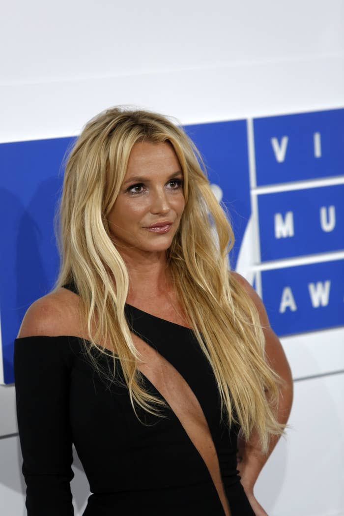 Brit posing for photos on the red carpet