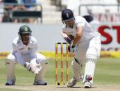 England's Nick Compton plays a shot with South Africa's Quinton de Kock during the second cricket test match in Cape Town, South Africa, January 2, 2016. REUTERS/Mike Hutchings