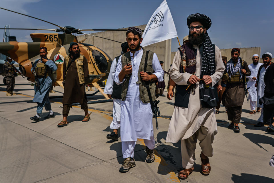 Anas Haqqani, center right, claimed western forces damaged Kabul airport during their evacuation. (Getty)