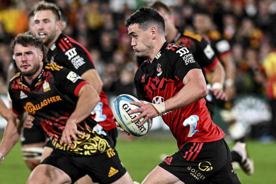 Will Jordan of the Crusaders makes a run during the Super Rugby Pacific final between the Chiefs and the Crusaders in Hamilton, New Zealand, Saturday, June 24, 2023. (Andrew Cornaga/Photosport via AP)