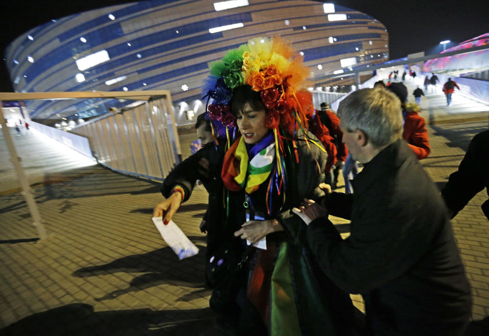 Vladimir Luxuria, a former Communist lawmaker in the Italian parliament and prominent crusader for transgender rights, is detained by police after entering the Shayba Arena at the 2014 Winter Olympics, Monday, Feb. 17, 2014, in Sochi, Russia. (AP Photo/David Goldman)