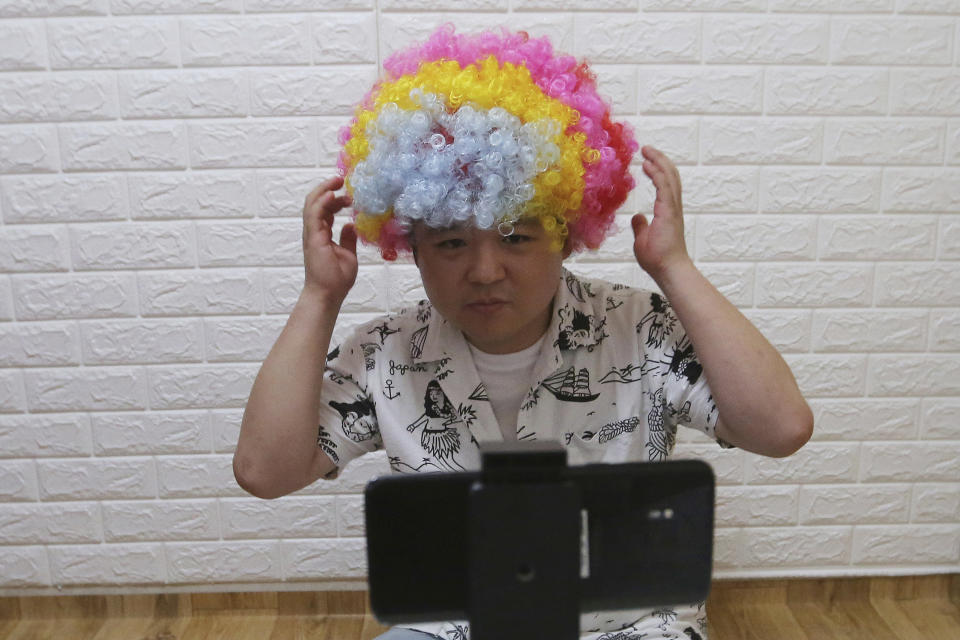 In this July 18, 2019, photo, North Korean refugee Jang Myung-jin films himself in a demonstration of his YouTube broadcast during an interview at his house in Seoul, South Korea. The 32-year-old Jang is among a handful of young North Korean refugees in South Korea who have launched YouTube channels that offer a rare glimpse into the everyday lives of people in North Korea, one of the world’s most secretive and repressive countries. (AP Photo/Ahn Young-joon)