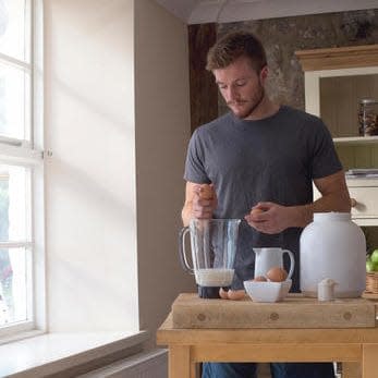 man making protein shake - Credit: Alamy