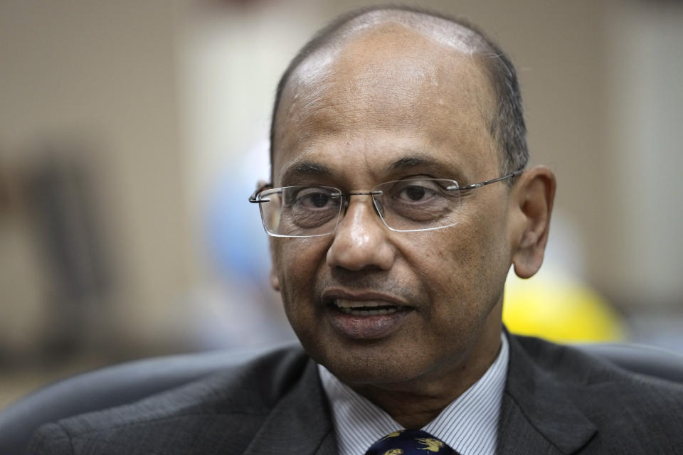 Ajay Mathur, director general of the International Solar Alliance, speaks to the Associated Press in his office in New Delhi, India, Wednesday, Oct. 27, 2021. India and the U.K. will launch a project that aims to create a solar grid connecting countries in different parts of the world at the upcoming U.N. climate talks in Glasgow, Scotland. The new project is based on the idea that the sun is always shining in some part of the world, and the project aims to create a global grid that will transfer the sun's power from one place to another, said Mathur. (AP Photo/Manish Swarup)