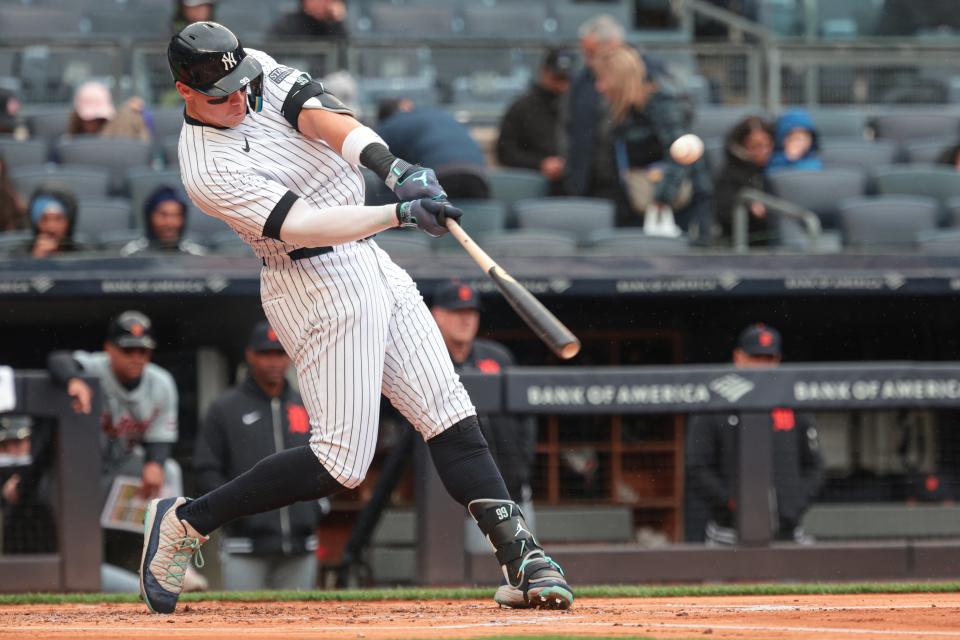 New York Yankees center fielder Aaron Judge (99) hits a solo home run during the first inning against the Detroit Tigers at Yankee Stadium in New York on Sunday, May 5, 2024.