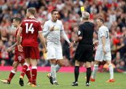 <p>Red, white and yellow: Chris Smalling is booked by referee Martin Atkinson</p>