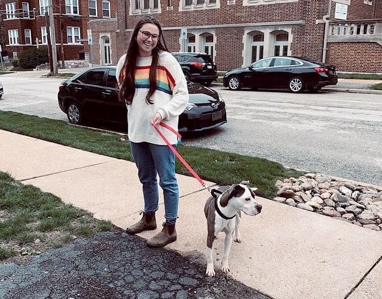 Megan Lemaire takes her foster dog, Vorhees, on a walk in St. Louis. Vorhees has lived with Megan and her roommate for three weeks. (Arno Goetz)